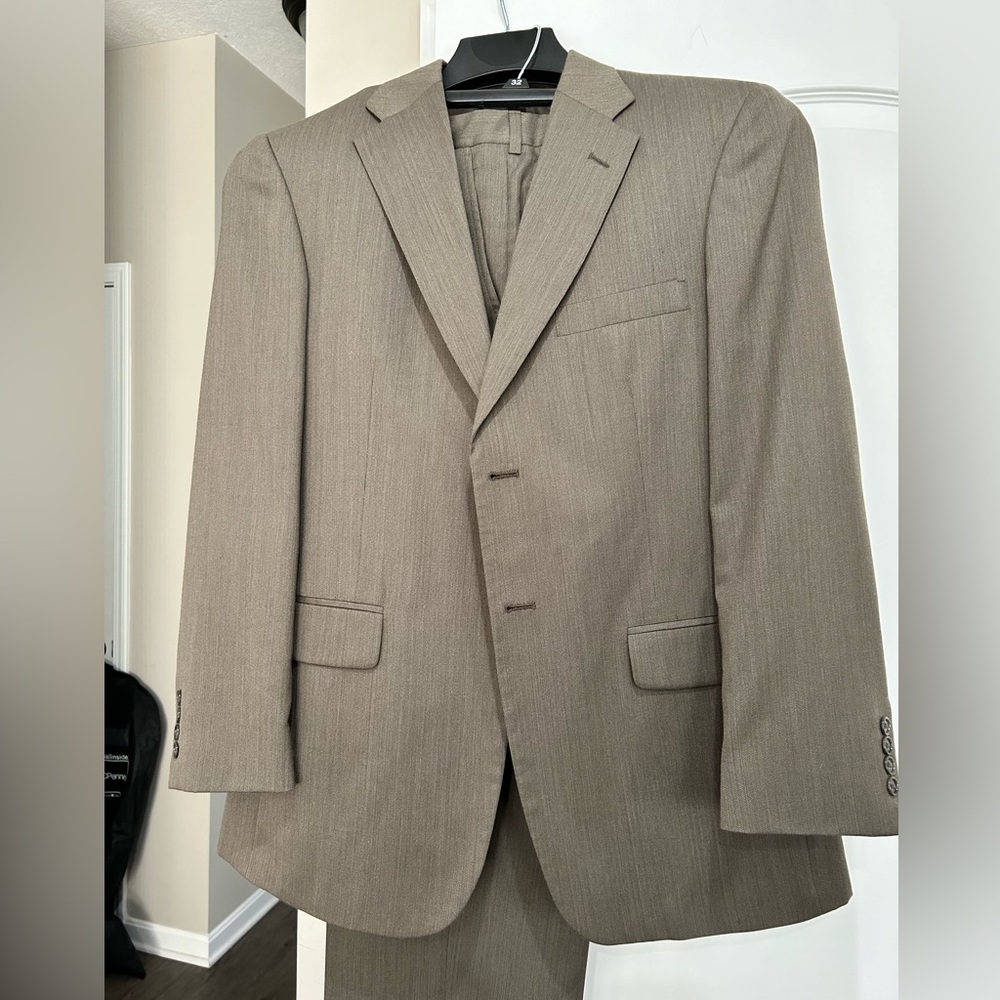 Men’s two-piece suit, brown, excellent condition, 40R coat, 32w x 30L pants.